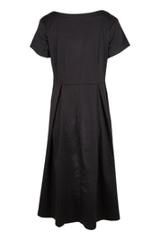 Product shot of the Belle Cotton Sateen Pleat Dress in colour Black (Black), from the back