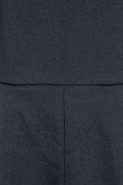 Product shot of the Belle Cotton Sateen Pleat Dress in colour Black (Black), detail