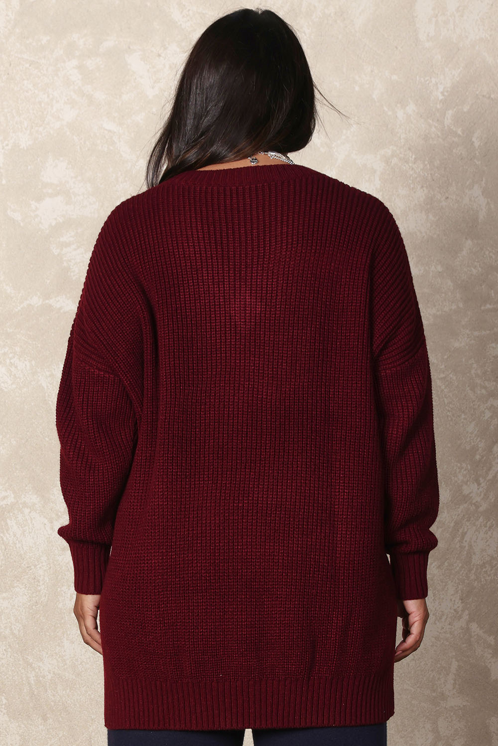 Model Ashleigh wearing size XL of the Belle Cosy V Neck Jumper in colour Burgundy (Purple), from the back