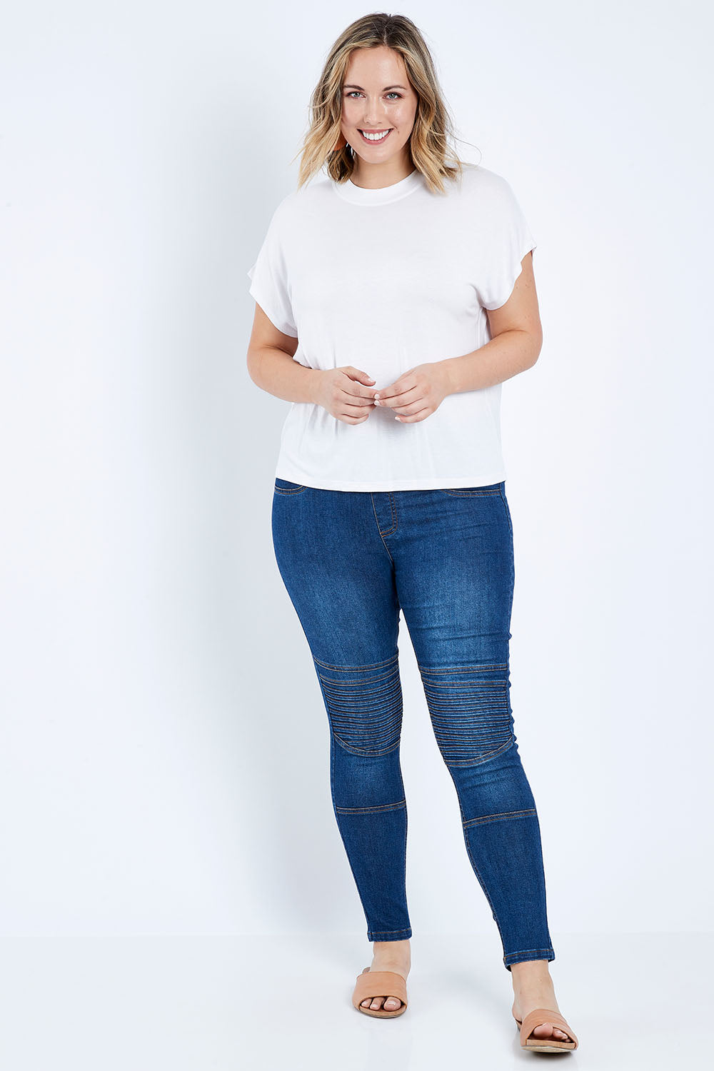 Model Jess wearing size 14 of the Wild Heart Stitched Jeggings in colour Drkdenim (Blue), from the front, showing the whole outfit
