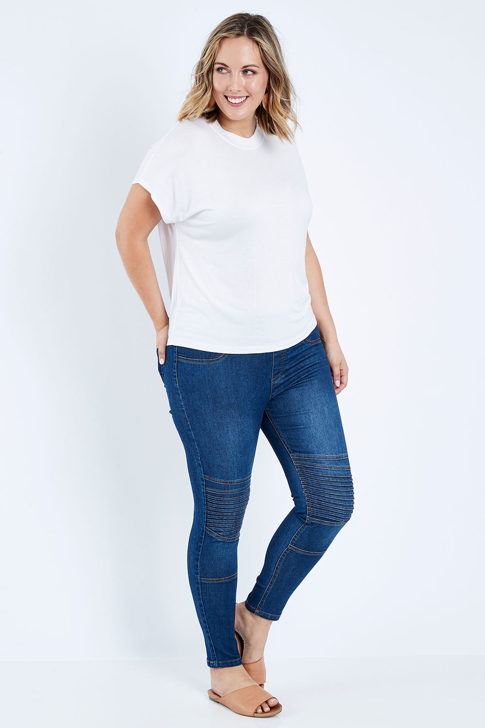 Model Jess wearing size 14 of the Wild Heart Stitched Jeggings in colour Drkdenim (Blue), from the front, showing the whole outfit