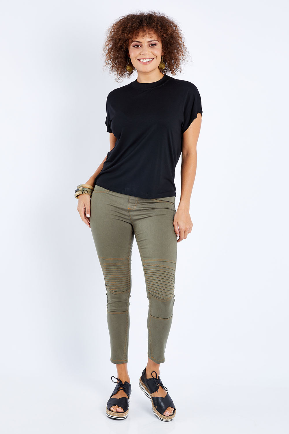 Model Lala wearing size 10 of the Wild Heart Stitched Jeggings in colour Khaki (Green), from the front, showing the whole outfit