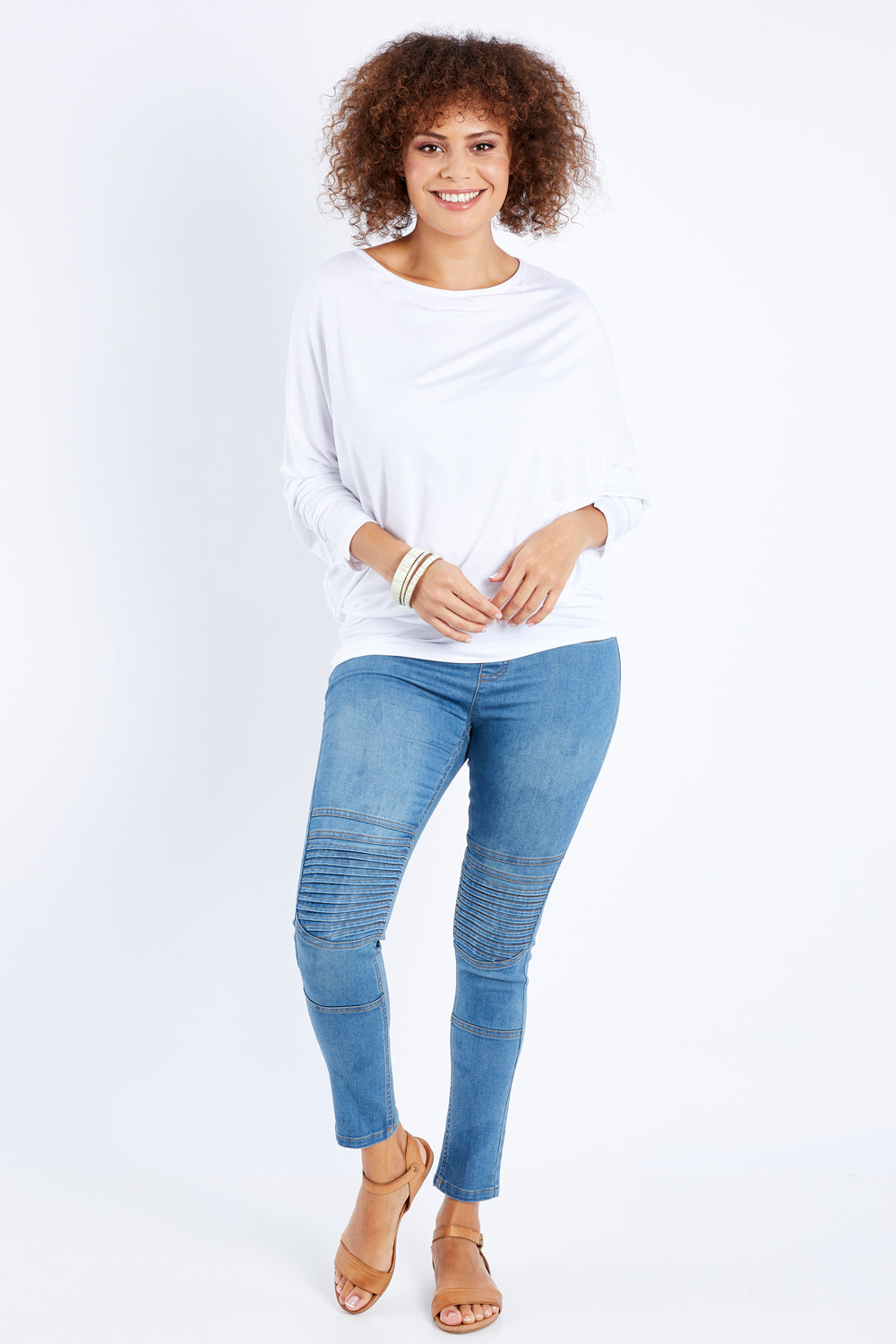 Model Lala wearing size 10 of the Wild Heart Stitched Jeggings in colour Lightdenim (Blue), from the front, showing the whole outfit