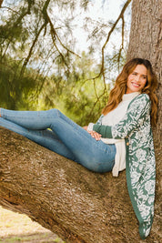 Model Ilona wearing size S of the My Hearts In The Garden Cardi in colour Foliage (Green), from the front, showing the whole outfit