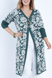 Model Jess wearing size L of the My Hearts In The Garden Cardi in colour Foliage (Green), from the front, cropped image