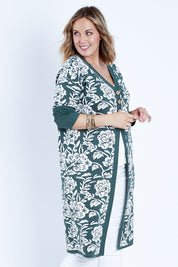 Model Jess wearing size L of the My Hearts In The Garden Cardi in colour Foliage (Green), from the front, cropped image