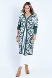 Model Jess wearing size L of the My Hearts In The Garden Cardi in colour Foliage (Green), from the front, showing the whole outfit