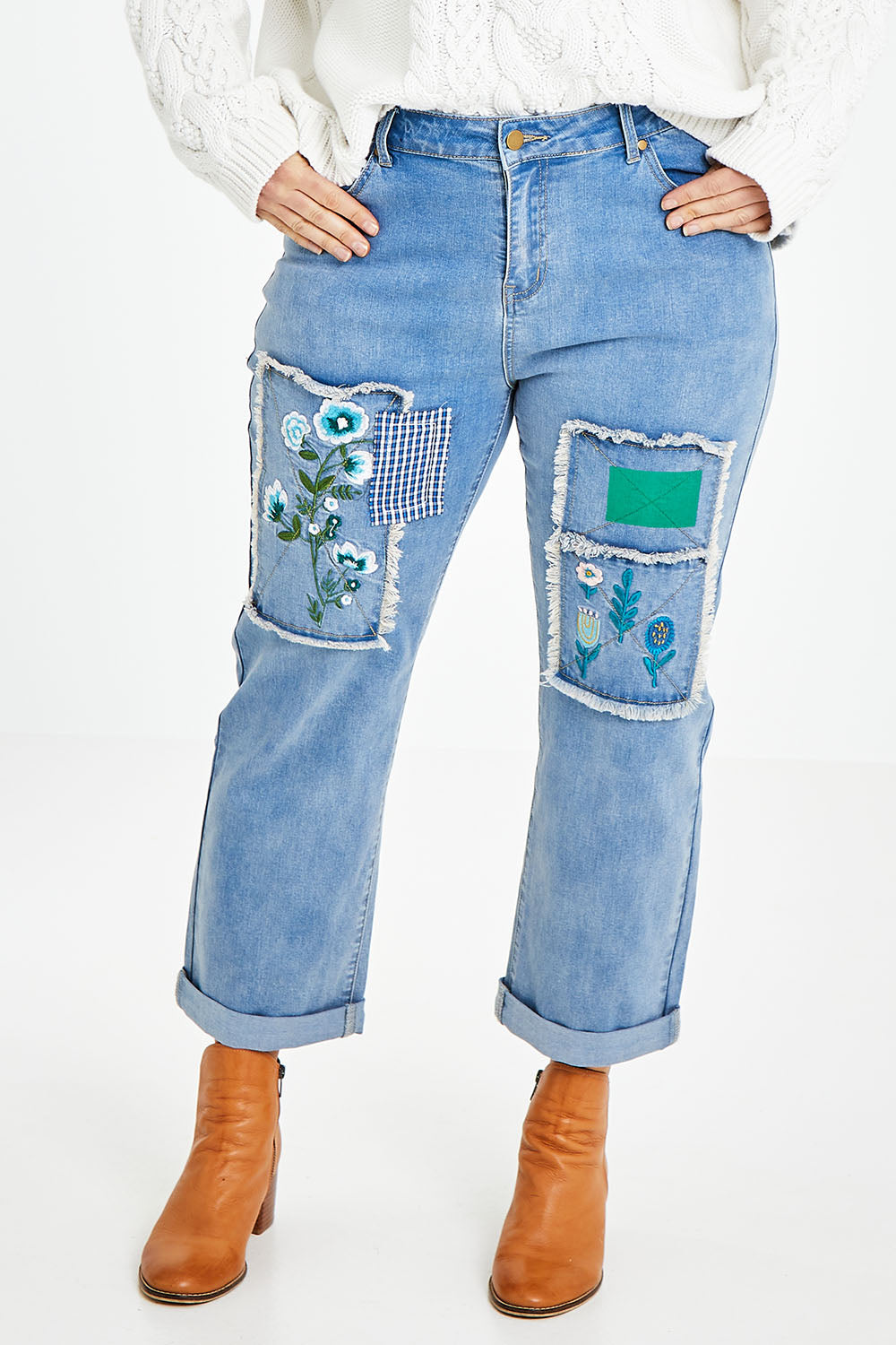 Model Laura wearing size 14 of the Patch You Up Slouch Jeans in colour Denimblue (Blue), from the front, cropped image