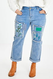 Model Laura wearing size 14 of the Patch You Up Slouch Jeans in colour Denimblue (Blue), from the front, cropped image