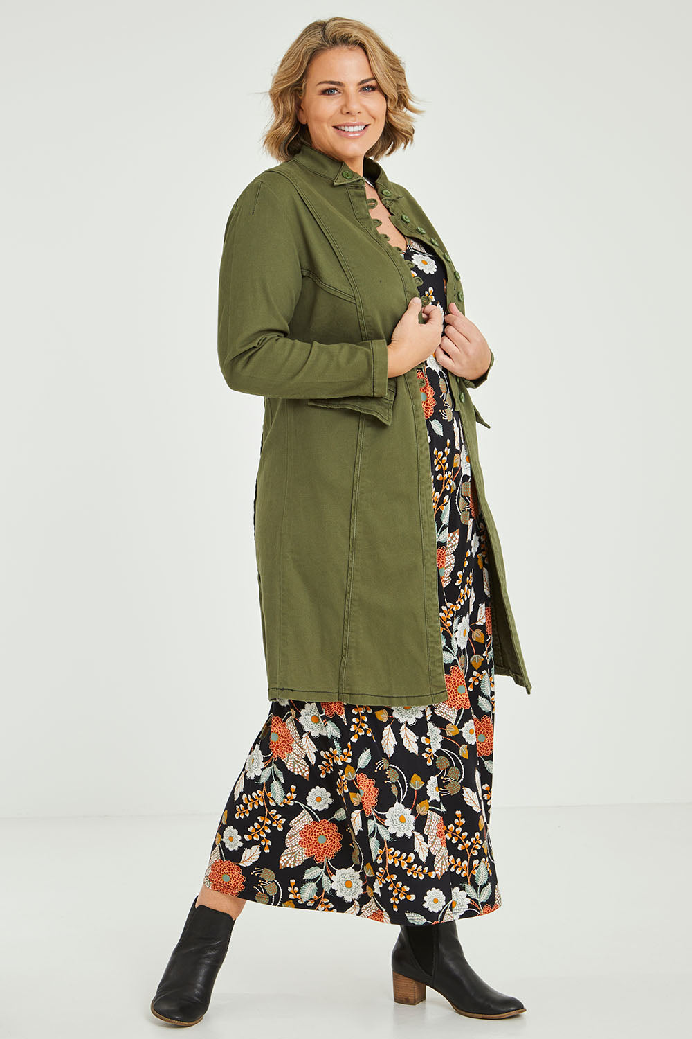Model Fiona wearing size 16 of the Attention To Me Jacket in colour Khaki (Green), from the front, showing the whole outfit