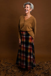 Model Elise wearing size 10 of the Chasing The Clouds Away Maxi Skirt in colour Sunset (Black), from the front, showing the whole outfit