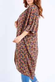 Model Laura wearing the Got You Covered Throw Cardi in colour Ditsy, from the front, cropped image