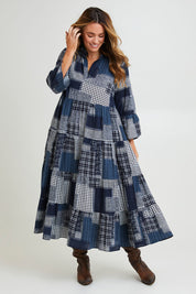 Model Laura wearing size 14 of the Its Easy Loving You Tiered Dress in colour Navypatch (Blue), from the front, showing the whole outfit