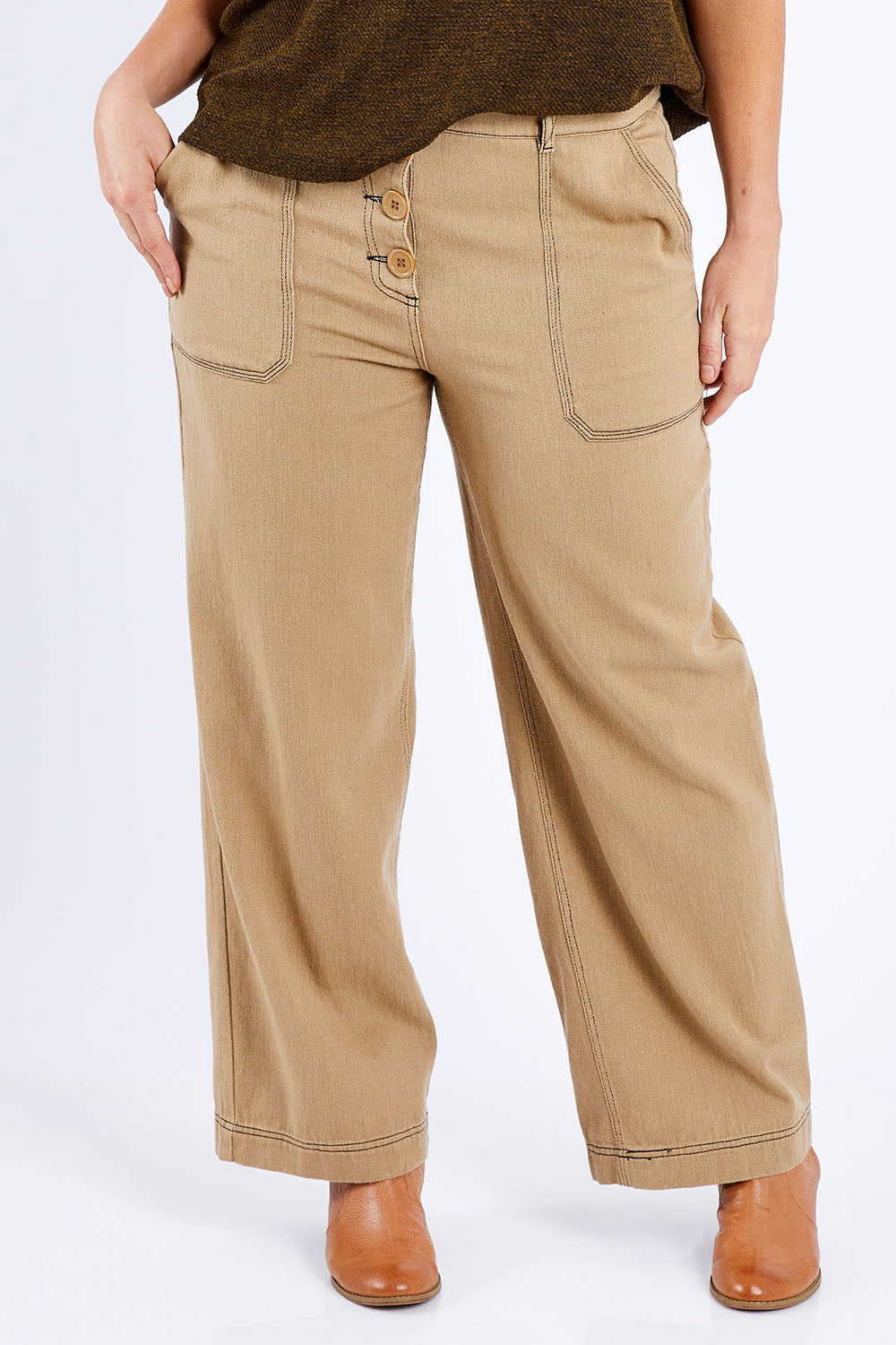 Model Laura wearing size 14 of the Chill Out Calling Jeans in colour Moss, from the front, cropped image