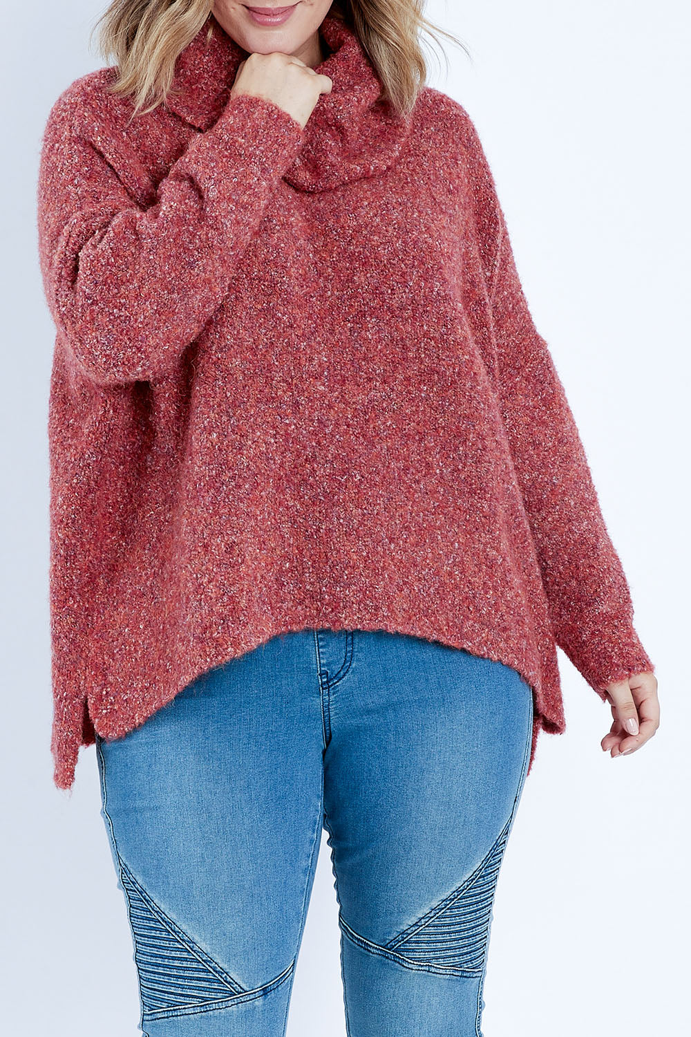 Model Jess wearing size L of the Soft Cloud Roll Neck Jumper in colour Brick (Red), from the front, cropped image