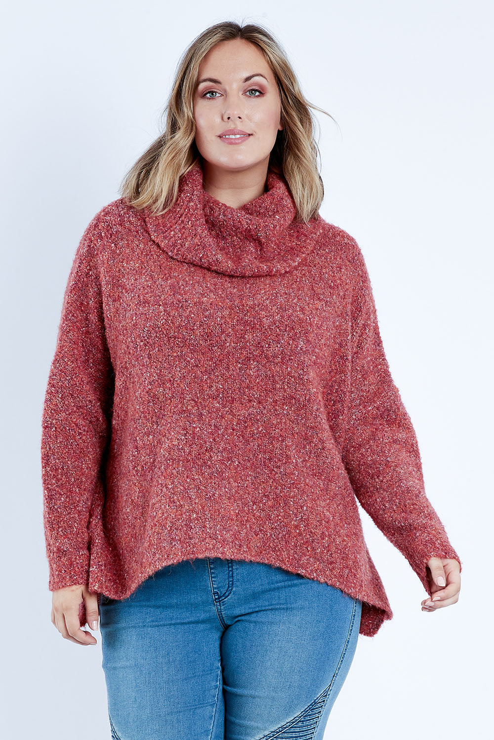 Model Jess wearing size L of the Soft Cloud Roll Neck Jumper in colour Brick (Red), from the front, cropped image