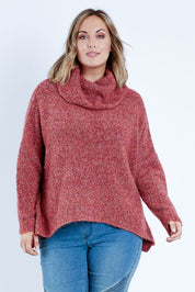 Model Jess wearing size L of the Soft Cloud Roll Neck Jumper in colour Brick (Red), from the front, cropped image
