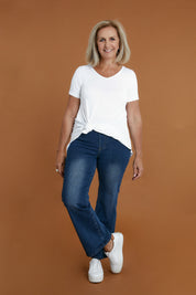Model Sandy wearing size 10 of the Easy As Pull On Jeans in colour Darkdenim (Blue), from the front, showing the whole outfit