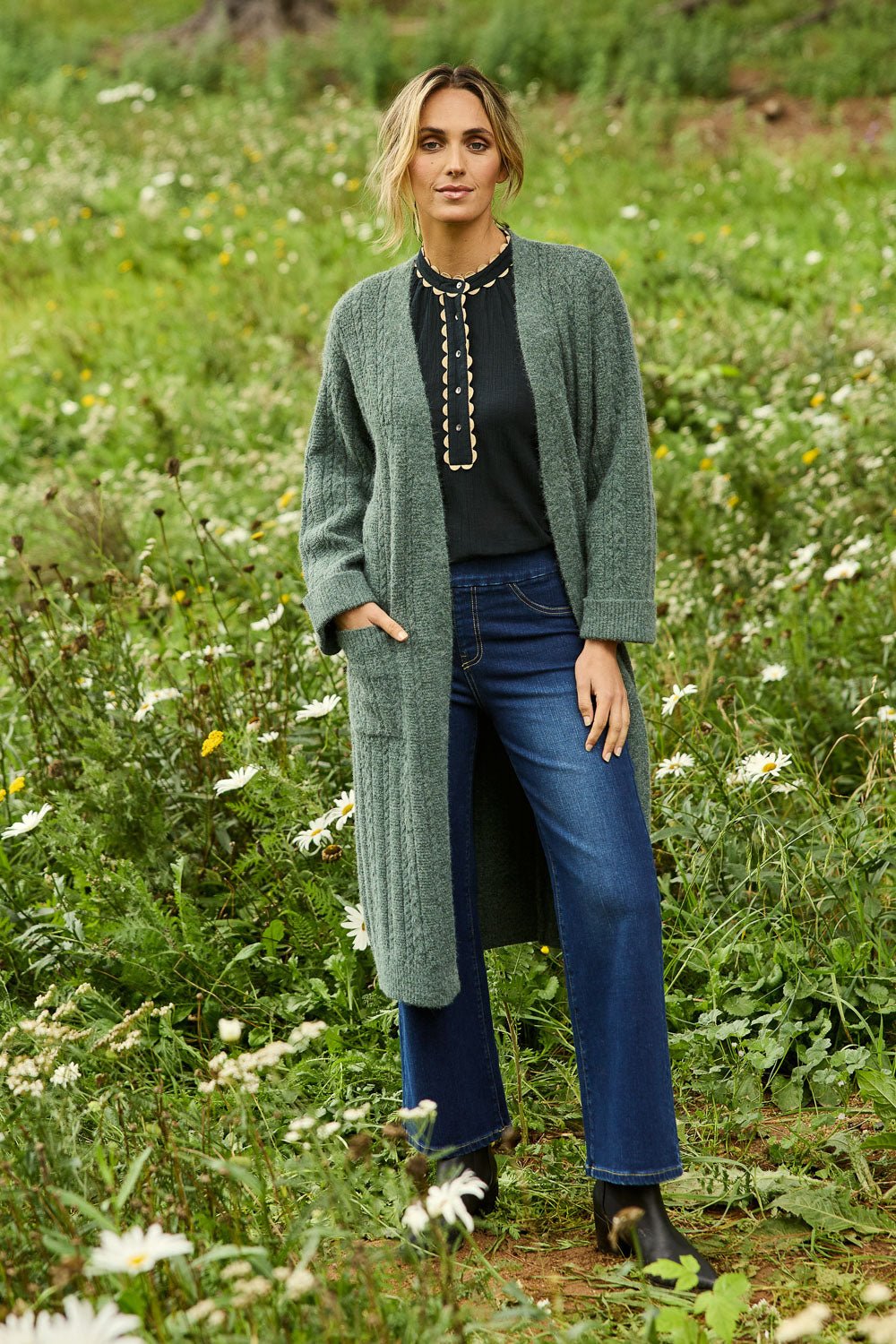 Model Tegan wearing size 10 of the Easy As Pull On Jeans in colour Darkdenim (Blue), from the front, showing the whole outfit