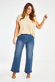 Model Laura wearing size 14 of the Preloved Easy As Pull On Jeans in colour Denim (Blue), from the front, showing the whole outfit
