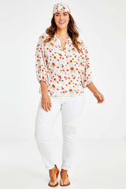 Model Laura wearing size 14 of the Sweet Pea Cotton Blouse in colour White (White), from the front, showing the whole outfit