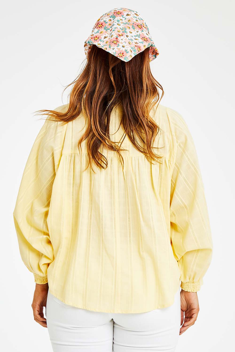 Model Laura wearing size 14 of the Easy Like A Sunday Morning Blouse in colour Buttermilk, from the back