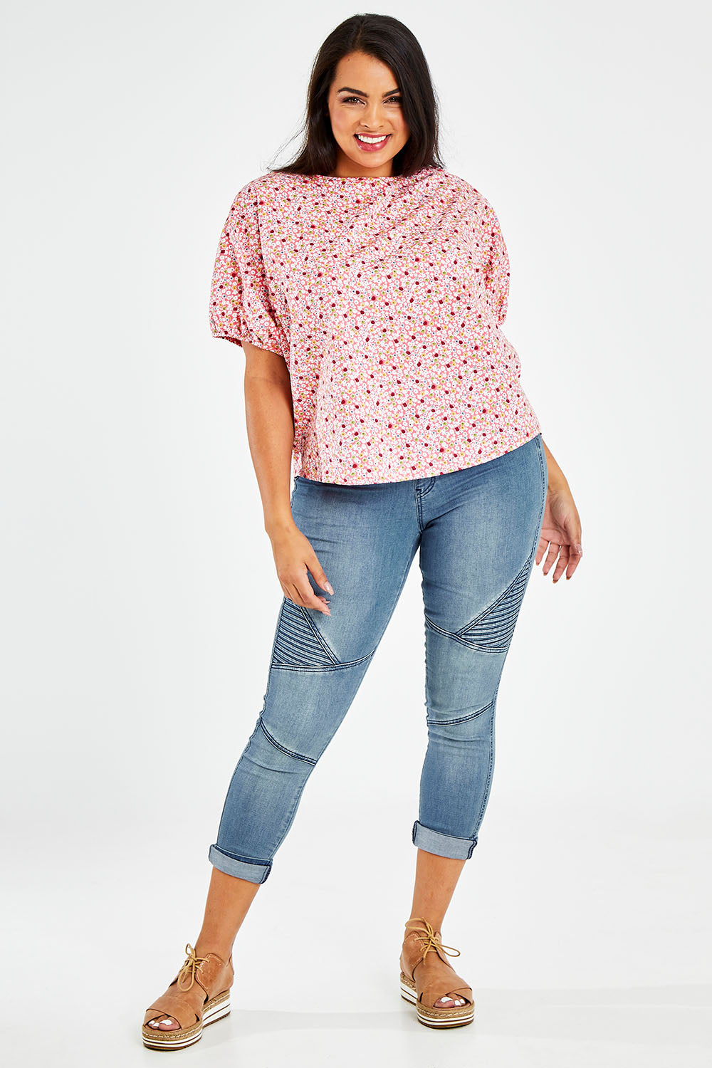 Model Sasha-Lee wearing size 16 of the Its All In The Sleeve Cotton Blouse in colour Peach (Pink), from the front, showing the whole outfit