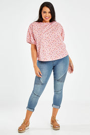 Model Sasha-Lee wearing size 16 of the Its All In The Sleeve Cotton Blouse in colour Peach (Pink), from the front, showing the whole outfit