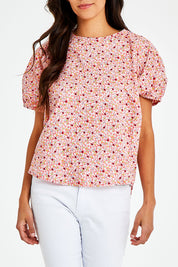 Model Vitoria wearing size 10 of the Its All In The Sleeve Cotton Blouse in colour Peach (Pink), from the front, cropped image