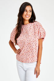 Model Vitoria wearing size 10 of the Its All In The Sleeve Cotton Blouse in colour Peach (Pink), from the front, cropped image