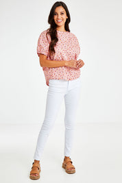 Model Vitoria wearing size 10 of the Its All In The Sleeve Cotton Blouse in colour Peach (Pink), from the front, showing the whole outfit