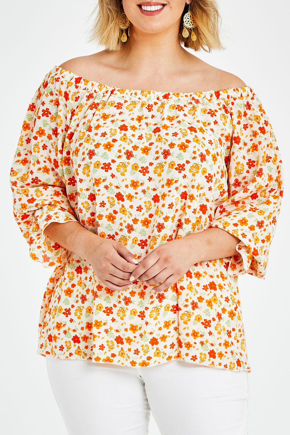 Model Jess wearing size 14 of the Picnic In The Fields Off Shoulder Blouse in colour Poppy (White), from the front, cropped image