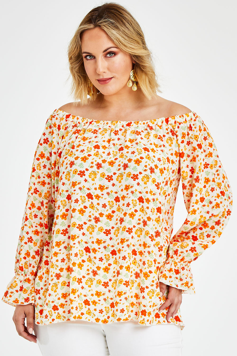 Model Jess wearing size 14 of the Picnic In The Fields Off Shoulder Blouse in colour Poppy (White), from the front, cropped image