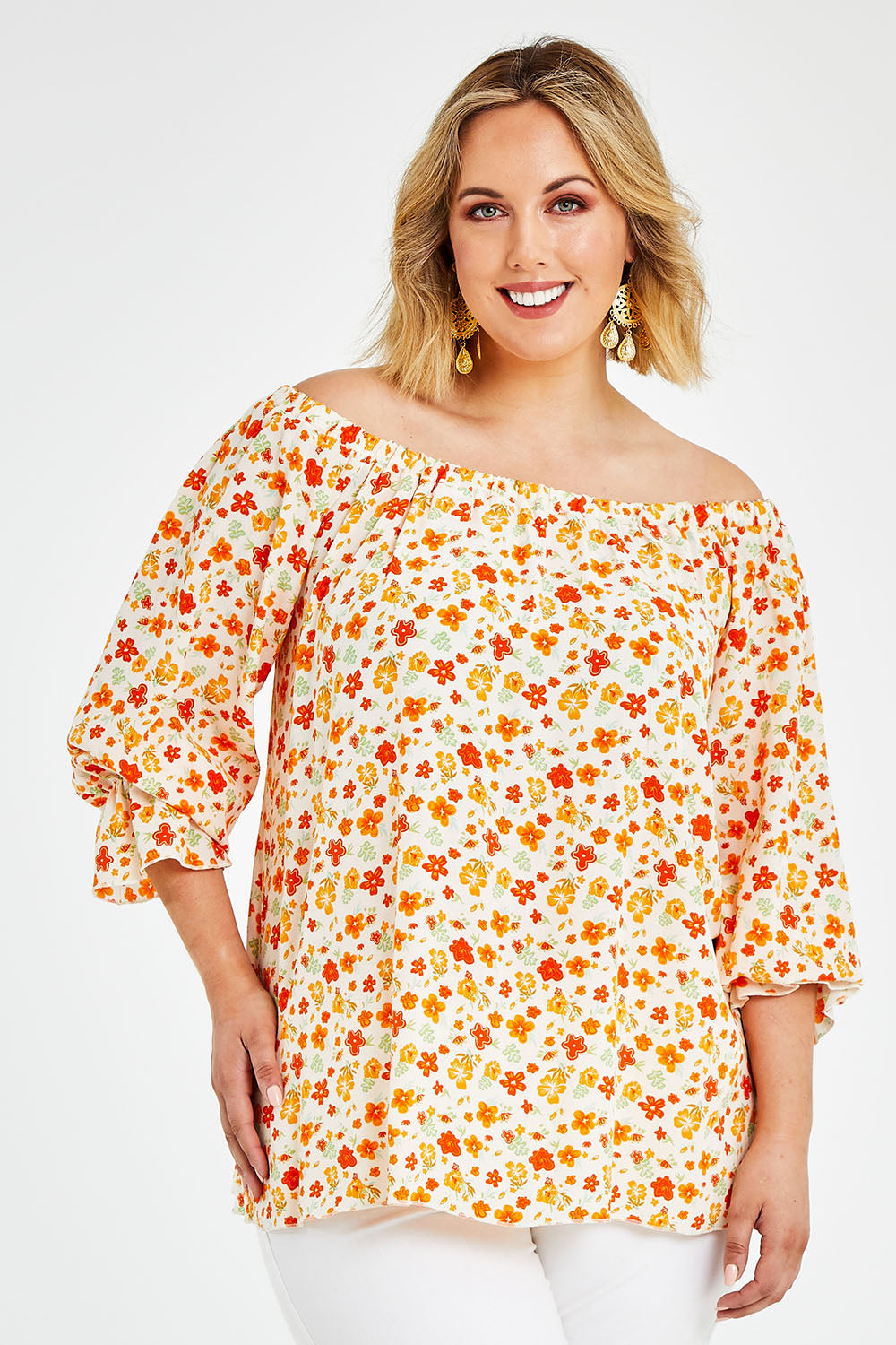 Model Jess wearing size 14 of the Picnic In The Fields Off Shoulder Blouse in colour Poppy (White), from the front, cropped image