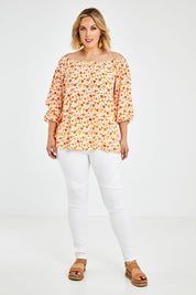 Model Jess wearing size 14 of the Picnic In The Fields Off Shoulder Blouse in colour Poppy (White), from the front, showing the whole outfit