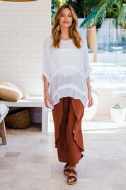 Model Ilona wearing size 10 of the You See Through Me Blouse in colour White (White), from the front, showing the whole outfit