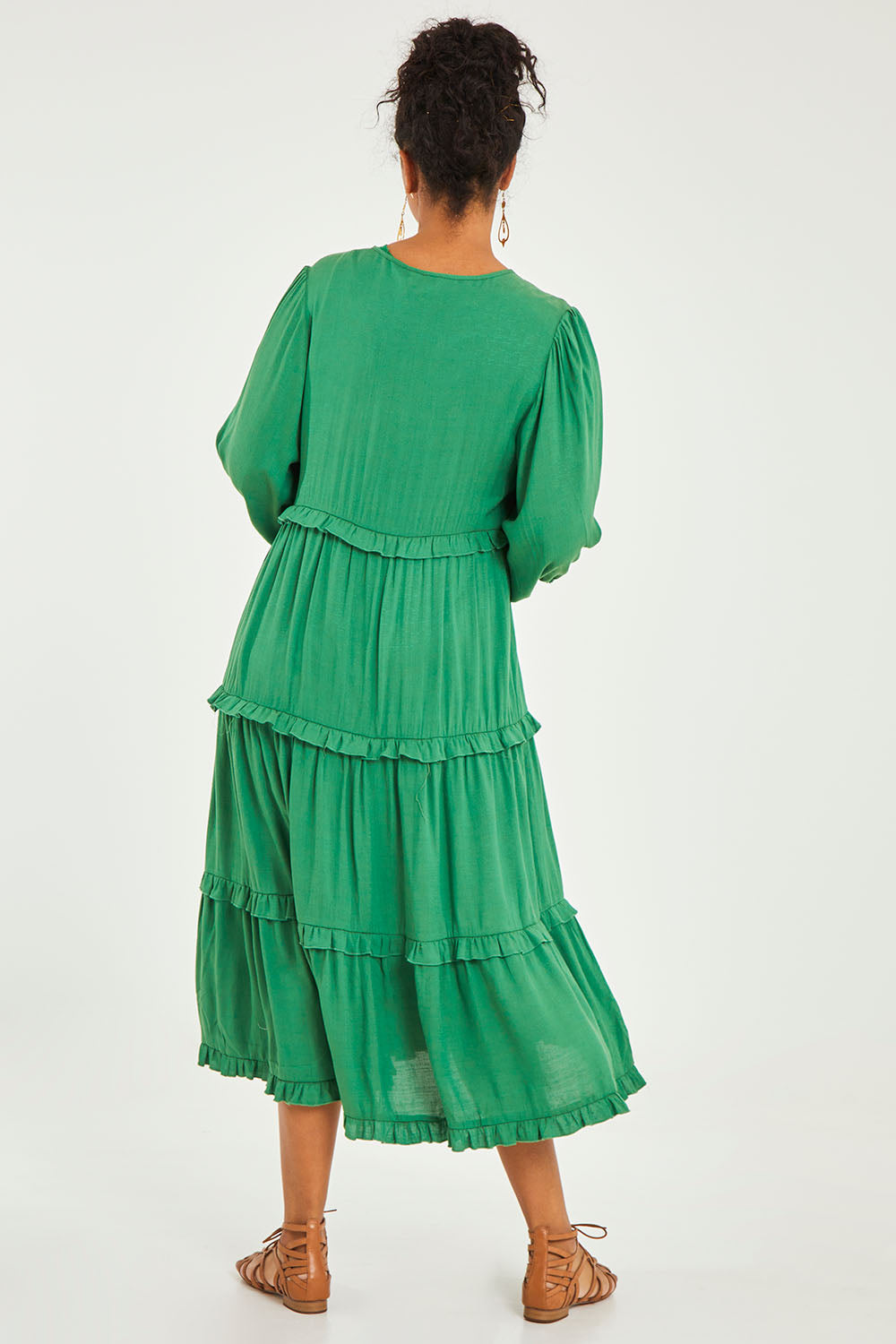 Model Noli wearing size 14 of the Tiers Of Laughter Maxi Dress in colour Emerald (Green), from the back
