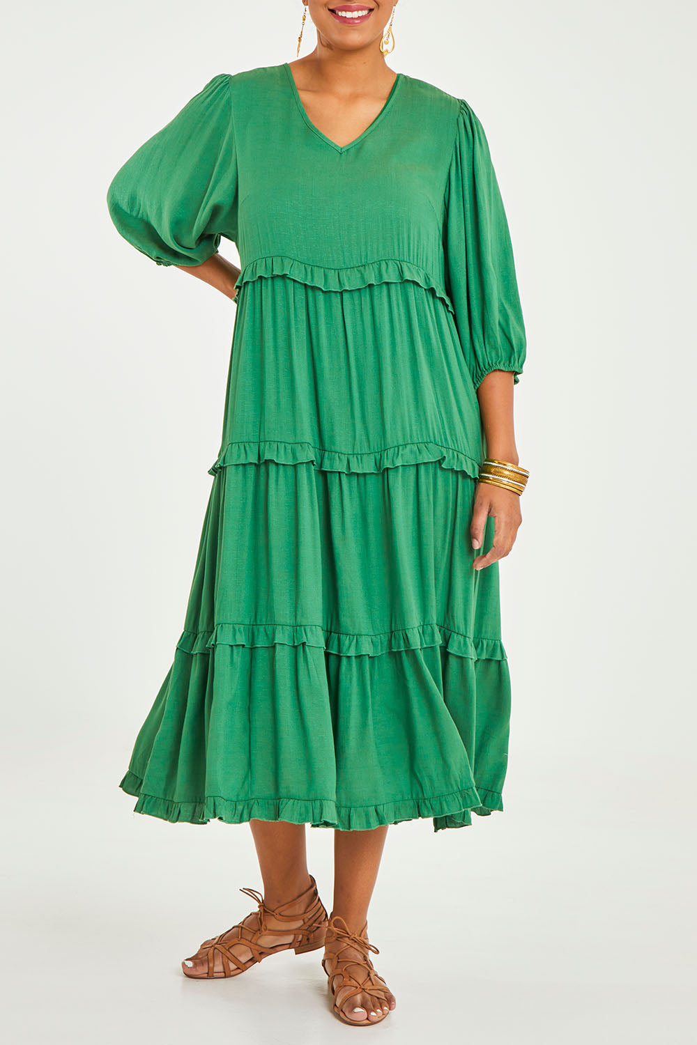 Model Noli wearing size 14 of the Tiers Of Laughter Maxi Dress in colour Emerald (Green), from the front, cropped image