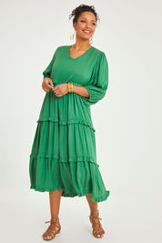 Model Noli wearing size 14 of the Tiers Of Laughter Maxi Dress in colour Emerald (Green), from the front, showing the whole outfit