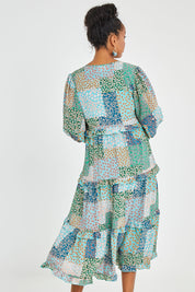Model Noli wearing size 14 of the Tiers Of Laughter Maxi Dress in colour Bluepatch (Blue), from the back