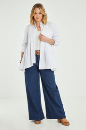 Model Jess wearing size 14 of The Frill You Give Me Blouse in colour White (White), from the front, showing the whole outfit