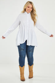 Model Katie wearing size 16 of The Frill You Give Me Blouse in colour White (White), from the front, showing the whole outfit