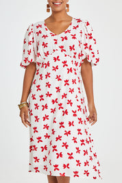 Model Noli wearing size 14 of the You Make Me Feel Like Dancing Dress in colour White (White), from the front, cropped image