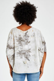 Model Olivia wearing size 10 of the With My Tribe Eco Printed Top in colour Ecoprint (Red), from the back