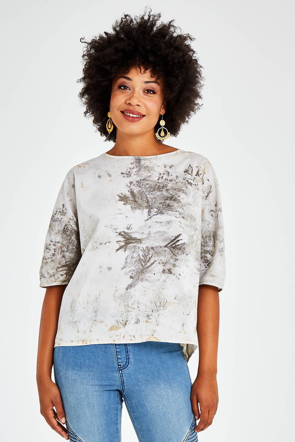 Model Olivia wearing size 10 of the With My Tribe Eco Printed Top in colour Ecoprint (Red), from the front, cropped image