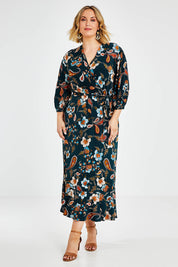 Model Jess wearing size 14 of the Feeling Free Faux Wrap Dress in colour Greenbay (Green), from the front, showing the whole outfit