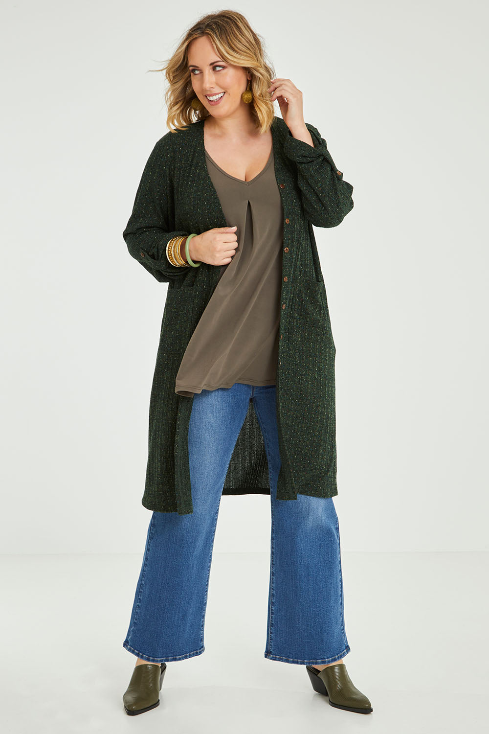 Model Jess wearing size 14 of the Into The Forest Cardi in colour Forest (Green), from the front, showing the whole outfit