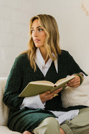 Model Tegan wearing size 10 of the Into The Forest Cardi in colour Forest (Green), from the front, showing the whole outfit