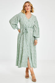 Model Jess wearing size 14 of the Field Of Dreams Button Up Dress in colour Greenfleur (Green), from the front, showing the whole outfit
