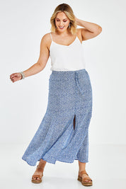 Model Jess wearing size 14 of the Nothing But Blue Skies Skirt in colour Bluefleur (Blue), from the front, showing the whole outfit